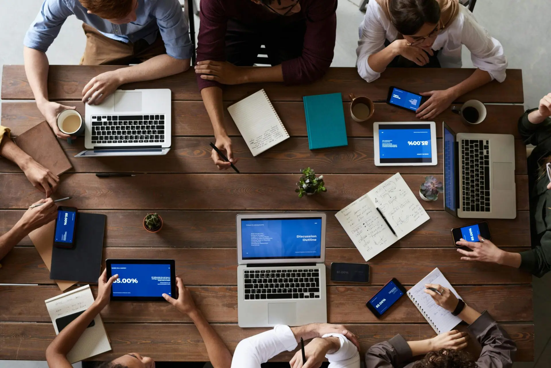 top-view-photo-of-people-near-wooden-table-stockpack-pexels Top view photo of people near wooden table